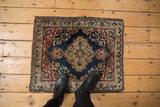 Upper corner of antique Kermanshah rug with pawn design border, scrolling vinery.