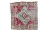 Distressed Oushak square rug with faded raspberry and mint medallion, floral motifs. 3'2