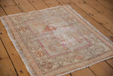 Vintage Distressed Oushak square mat, worn pile, visible foundation, magenta, and faded floral motifs.