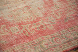 Vintage Distressed Oushak rug detail: worn blush, ivory, green vinery, abrashed ground.