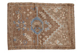 Vintage distressed Oushak rug featuring a denim blue serrated medallion. Earthy brown, 2'7