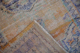 Close-up of the vintage distressed Oushak rug's worn pile, exposed knot heads, and hand-knotted underside.