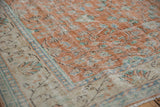 Distressed Turkish Oushak carpet with worn terra cotta field and ivory palmette border.