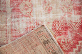 Distressed Oushak rug pile, pale red and ivory, showing wear, foundation, and reverse.