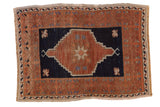 Distressed Oushak square rug with copper medallion and navy ground, 2'4
