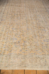 Distressed Oushak carpet surface with mostly even wear, foundation showing through, faded vinery.