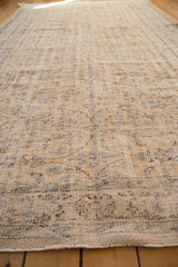 Vintage distressed Oushak carpet pile with mostly even wear showing foundation, pale gold, and muted blue.