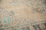 Distressed vintage Oushak rug texture revealing mostly even wear, aqua mint and charcoal patterns.