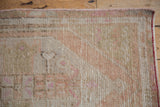 Textured distressed Oushak runner pile, showing ivory, beige, pink, and visible knot heads.