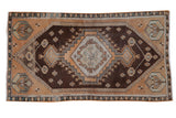 Vintage Distressed Oushak runner with chocolate, rust apricot, ivory stepped diamond medallion. 2'8