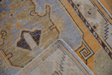 Distressed vintage Oushak rug runner's geometric border and textured pile, showing hand-knotted reverse.