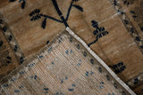 Distressed vintage Oushak rug corner revealing worn pile and woven foundation.