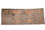 Vintage distressed Oushak runner with primitive geometric starbursts, burnt orange and charcoal.