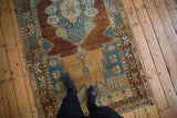 Distressed Oushak runner, copper and sky blue geometric border featuring starburst motif.