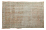 Distressed vintage Oushak carpet with faded terra cotta, ivory, mint green scrolling tendrils.