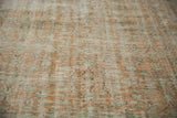 Vintage Distressed Oushak carpet showing worn texture, visible knot heads, soft apricot, and mint colors.