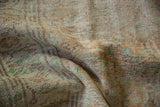 Distressed Oushak carpet pile featuring worn knot heads and muted apricot, beige, mint patterns.