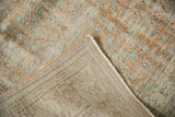 Distressed Oushak carpet pile with visible wear and light woven foundation.