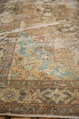 Distressed Oushak rug texture with low pile, visible knot heads, aqua, and saffron.