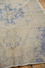 Distressed texture with faint foundation showing through faded pale royal blue motifs.