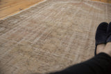 Distressed pile of the vintage Oushak runner in soft beige and pale sand colors.