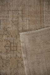 Distressed pile with visible foundation and back of a vintage hand knotted Oushak runner.