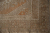 Distressed texture and even wear with intact selvage on this vintage Oushak rug corner.