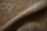Worn pile texture and muted coffee brown, silver tones on this distressed Vintage Oushak rug.