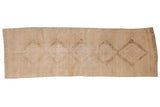 Distressed Oushak runner rug with faded geometric medallions in muted ivory and sand, 3'4