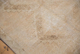 Textured distressed pile of vintage Oushak runner, with muted ivory and sand zig-zag motif.
