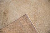 Hand-knotted foundation and textured neutral pile of a Vintage Oushak rug.