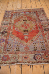 Vintage Oushak rug corner with tree of life, lily petals, abrashed rust and muted blue.