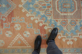A personal view of the soft, low pile texture on a vintage distressed Oushak carpet.