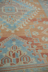Stepped geometric motifs in cinnabar and sky blue showing the soft, even wear of a vintage Oushak.
