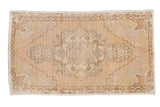 Vintage distressed Oushak rug mat, beige central medallion, pale green floral spandrels, 1'8