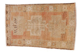 Distressed vintage Oushak rug, geometric triple medallions, crab border, beige, faded terracotta.