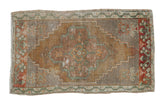 Distressed vintage Oushak rug mat, central floral medallion, faded rust and green, 1'8