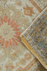 Distressed Oushak rug with worn pile texture, subtle pattern, and knotted reverse.