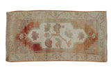Distressed Oushak rug mat with germinating rosebush medallion, terra cotta, beige, mint green.