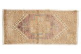 Distressed hand-knotted Oushak runner, tree of life medallion in beige, violet, turquoise.