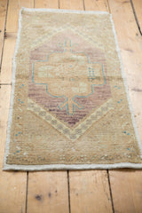 Vintage Oushak rug: distressed texture, abrashed violet-beige field, turquoise tree-of-life motif.