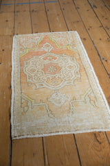 Worn texture and intact side selvage of the vintage distressed Oushak rug.