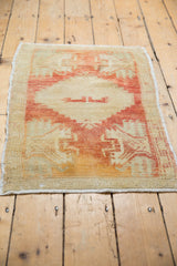 Vintage Distressed Oushak rug mat's light fringe and faded brick red, beige pile with even wear.