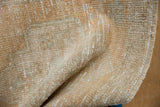 Vintage distressed Oushak rug pile texture, with mostly even wear and faint foundation.