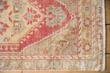 Distressed Vintage Oushak rug corner shows fringe and brick red texture with mostly even pile wear.