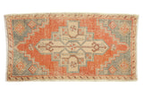 Vintage distressed Oushak rug, oversized geometric floral medallion, burnt orange, beige, slate blue.