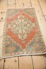 Designer-aligned distressed Oushak rug texture with pops of burnt orange and slate blue.