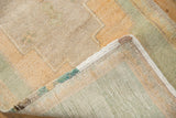 Vintage Distressed Oushak rug pile in pale apricot, beige, seafoam green, revealing intact selvage.