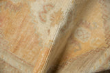 Distressed vintage Oushak rug pile, showing even wear and soft terracotta orange hues.