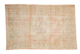 Distressed vintage Oushak rug with subtle triple rose medallion in blush and ivory, 2'9